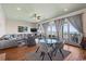 Spacious living room with ocean view, hardwood floors, and comfy furniture at 132 N Waccamaw Dr., Murrells Inlet, SC 29576
