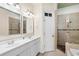 Double vanity bathroom with large shower and soaking tub at 132 N Waccamaw Dr., Murrells Inlet, SC 29576