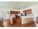 Spacious kitchen with wood cabinets, tile counters, and stainless steel appliances at 132 N Waccamaw Dr., Murrells Inlet, SC 29576