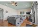 Spacious living room featuring a large sectional sofa and hardwood floors at 132 N Waccamaw Dr., Murrells Inlet, SC 29576