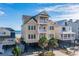 Three-story beach house with ocean views and private parking at 132 N Waccamaw Dr., Murrells Inlet, SC 29576