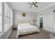 Spacious bedroom with a comfortable bed, nightstand, and ample natural light at 132 N Waccamaw Dr., Murrells Inlet, SC 29576