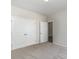 Spacious bedroom with neutral walls, carpet, and double door closet at 612 Woodside Dr., Conway, SC 29526