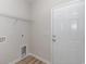 Laundry room with shelving, flooring, and door to outside at 612 Woodside Dr., Conway, SC 29526
