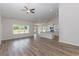 Spacious living room with high ceilings, hardwood floors, and kitchen views at 612 Woodside Dr., Conway, SC 29526