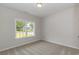 Well-lit bedroom with carpeted floors and a window at 612 Woodside Dr., Conway, SC 29526