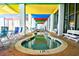 Indoor hot tub with colorful ceiling and seating at 6804 N Ocean Blvd. # 627, Myrtle Beach, SC 29572