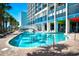 Inviting resort-style pool with surrounding lounge chairs and palm trees at 6804 N Ocean Blvd. # 627, Myrtle Beach, SC 29572