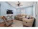 Relaxing living room with sectional sofa and large TV at 6001 - 8039 S Kings Hwy., Myrtle Beach, SC 29575