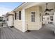 Spacious gray deck with white railings and ceiling fans at 6001 - 8039 S Kings Hwy., Myrtle Beach, SC 29575