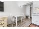 Small dining area with white table and chairs at 1205 S Ocean Blvd. # 20702, Myrtle Beach, SC 29577