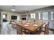 Open concept dining area with wood table and chairs, adjacent to living room at 872 Jackson Circle, Conway, SC 29526