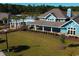 Community clubhouse with pool, pergola, and open green space at 7048 Watercress St, Myrtle Beach, SC 29579