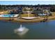 Community pool and clubhouse surrounded by a pond with a fountain at 7048 Watercress St, Myrtle Beach, SC 29579