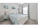 Charming bedroom with white bed frame and coastal decor at 4206 Falls Oaks St., Myrtle Beach, SC 29579