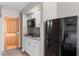 Compact kitchenette with microwave, sink, and small refrigerator at 9550 Shore Dr. # 1202, Myrtle Beach, SC 29572
