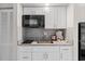 Small kitchen with granite countertops, microwave and coffee maker at 9550 Shore Dr. # 1202, Myrtle Beach, SC 29572