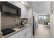 Small kitchenette with granite countertops and modern appliances at 9550 Shore Dr. # 1202, Myrtle Beach, SC 29572