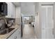 Compact kitchen featuring granite countertops and modern appliances at 9550 Shore Dr. # 1202, Myrtle Beach, SC 29572