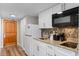 Small galley kitchen with granite countertop and appliances at 9550 Shore Dr. # 831, Myrtle Beach, SC 29572