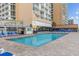 Inviting outdoor pool area with comfortable lounge chairs and ocean views at 9550 Shore Dr. # 831, Myrtle Beach, SC 29572