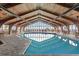 Indoor pool with large windows and wooden beams at 9550 Shore Dr. # 831, Myrtle Beach, SC 29572