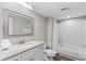 Clean bathroom with granite countertop, white cabinets, and a shower/tub combo at 9550 Shore Dr. # 831, Myrtle Beach, SC 29572