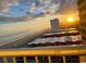 Stunning oceanfront view at sunset, beach and building rooftops visible at 9550 Shore Dr. # 831, Myrtle Beach, SC 29572