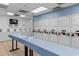 On-site laundry facility with multiple washers and dryers for residents at 2001 S Ocean Blvd. # 1005, Myrtle Beach, SC 29577