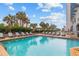Outdoor pool with lounge chairs, perfect for relaxation at 2001 S Ocean Blvd. # 1005, Myrtle Beach, SC 29577