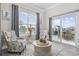 Bright sunroom with comfy seating and sliding glass doors leading to a patio at 5015 Vinesia Dr., Myrtle Beach, SC 29579