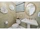 Powder room with pedestal sink, decorative wall tiles, and gold accents at 4809 Burchap Dr., Myrtle Beach, SC 29577