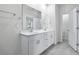 Bright bathroom featuring a double vanity and tile flooring at 634 Blackthorne Circle Nw, Calabash, NC 28467