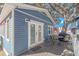 Blue cottage features a deck with outdoor furniture and a grill at 6001-1157 S Kings Hwy., Myrtle Beach, SC 29575