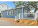 Blue house exterior with a white deck and stairs leading to the deck at 6001-1157 S Kings Hwy., Myrtle Beach, SC 29575