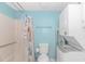 Bathroom with shower, toilet and stackable washer and dryer at 6001-1157 S Kings Hwy., Myrtle Beach, SC 29575