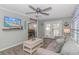 Living room with gray couch, coffee table, and view into dining area at 6001-1157 S Kings Hwy., Myrtle Beach, SC 29575
