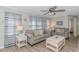 Living room with gray couches, a coffee table, and beach-themed decor at 6001-1157 S Kings Hwy., Myrtle Beach, SC 29575