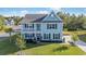 Two-story light-blue house with a white garage and well-maintained lawn at 1315 Bermuda Grass Dr., Myrtle Beach, SC 29579