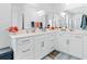 Modern double vanity bathroom with white cabinets and quartz countertops at 1315 Bermuda Grass Dr., Myrtle Beach, SC 29579