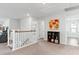 Upstairs hallway with a bookshelf and access to bedrooms at 1315 Bermuda Grass Dr., Myrtle Beach, SC 29579