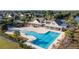Aerial view of community pool with clubhouse and surrounding homes at 1315 Bermuda Grass Dr., Myrtle Beach, SC 29579
