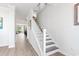 Modern staircase with white railings and dark wood steps leading to the second floor at 1315 Bermuda Grass Dr., Myrtle Beach, SC 29579