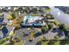 Aerial view of community pool, clubhouse, and adjacent lake at 1315 Bermuda Grass Dr., Myrtle Beach, SC 29579