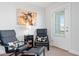 Cozy sitting area with two chairs and access to balcony at 1315 Bermuda Grass Dr., Myrtle Beach, SC 29579