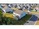 Aerial view of a two-story house, showcasing its backyard and screened porch at 1315 Bermuda Grass Dr., Myrtle Beach, SC 29579