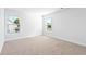 Spacious bedroom with neutral carpeting and two windows at 1315 Bermuda Grass Dr., Myrtle Beach, SC 29579