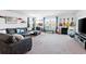 Spacious living room with sectional sofa and wall of guitars at 1315 Bermuda Grass Dr., Myrtle Beach, SC 29579