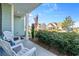 Front porch with white chairs overlooking a neighborhood street at 1315 Bermuda Grass Dr., Myrtle Beach, SC 29579
