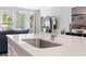 Modern kitchen sink and faucet with quartz countertops at 1315 Bermuda Grass Dr., Myrtle Beach, SC 29579